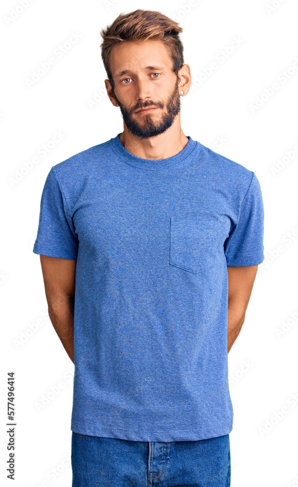Fototapeta premium Handsome blond man with beard wearing casual clothes with serious expression on face. simple and natural looking at the camera.
