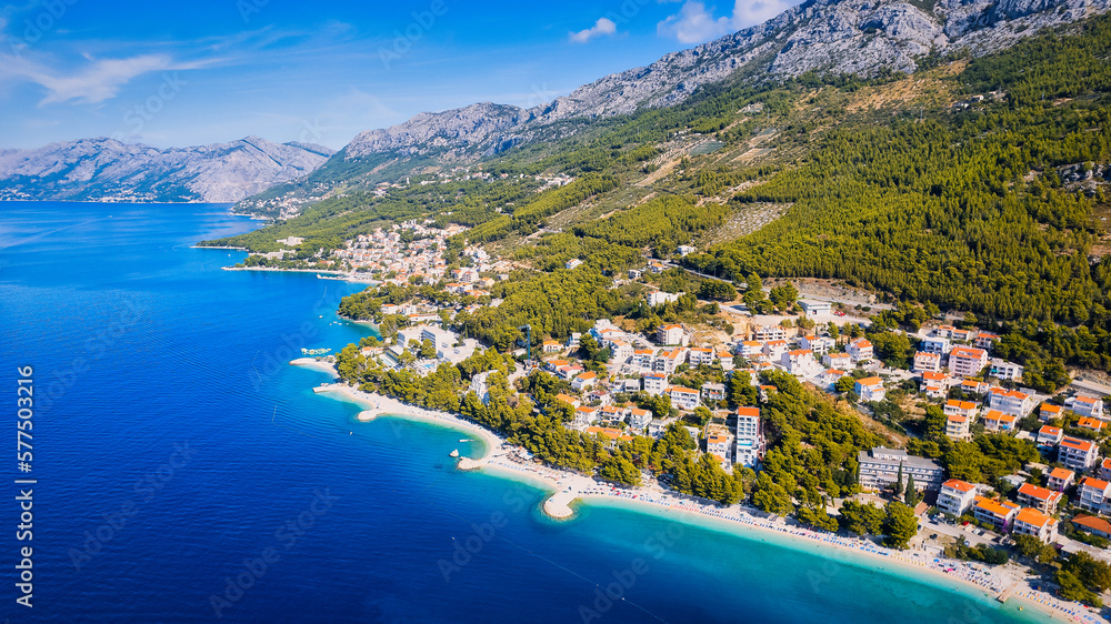 Marvel at the stunning aerial perspective of Croatia's Makarska Riviera, displaying a rocky beach and the captivating turquoise water.