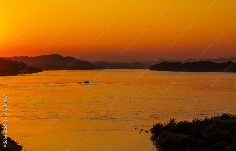 View of the Mekong River in Thailand in the evening,The ship is sailing in the Mekong River in In the morning, the sunrise in the Golden Triangle, Chiang Rai, Thailand