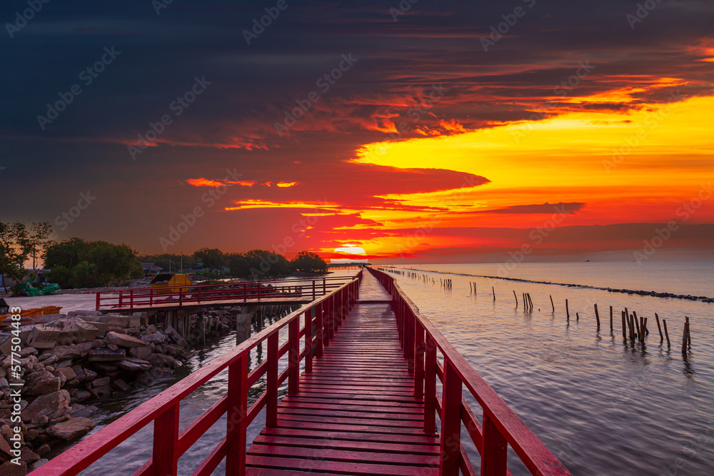 Sea coast and wooden bridge,View of wooden bridges and coastline at sunrise,Wooden bridge at the sea at sunset