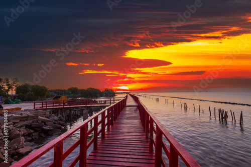Sea coast and wooden bridge View of wooden bridges and coastline at sunrise Wooden bridge at the sea at sunset