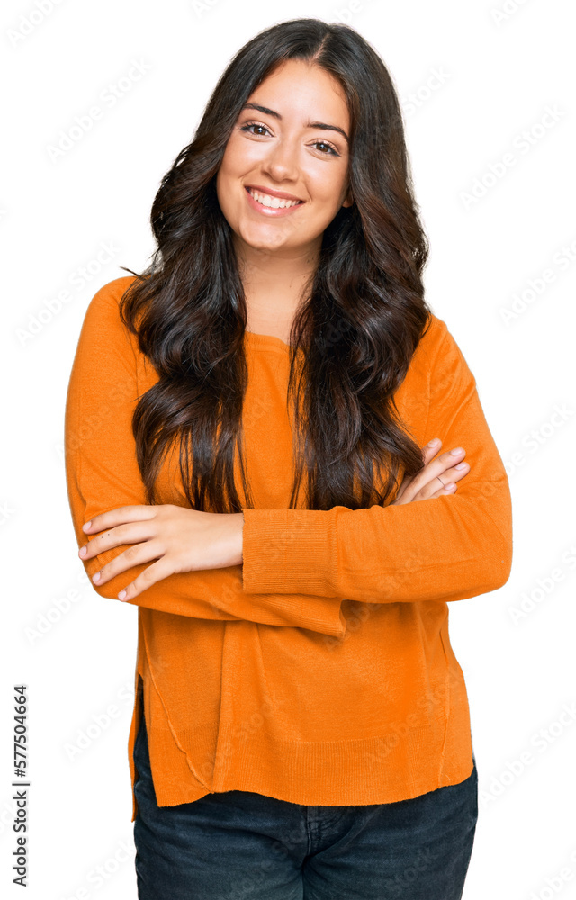 Beautiful brunette young woman wearing casual orange sweater happy face smiling with crossed arms looking at the camera. positive person. Beautiful brunette young woman wearing casual orange sweater happy face smiling with crossed arms looking at the camera. positive person.