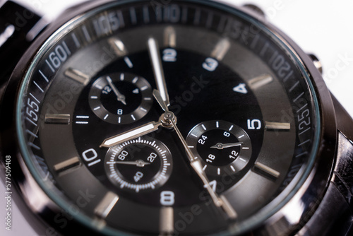Black wist watch on white background. Steel black mecanical watch, swiss made luxury, close up
