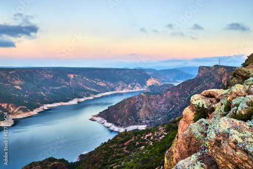 dam in the morning at blue hour, mountains with desertic vegetation, zimapan hidalgo	 photo