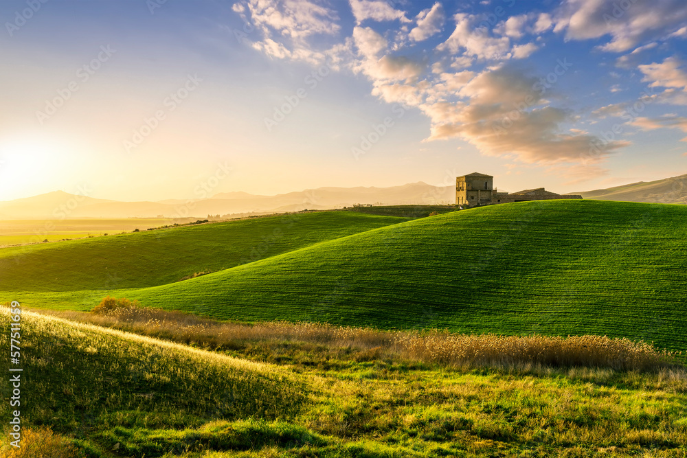 scenery rural view of a contryside farm in green fields and hills with amazing cloudy sky on background scenery rural view of a contryside farm in green fields and hills with amazing cloudy sky on background