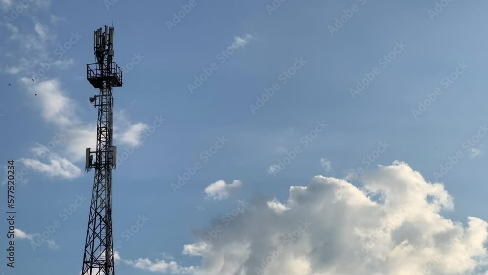 A cell tower against the blue evening sky. A cell tower against the blue evening sky.