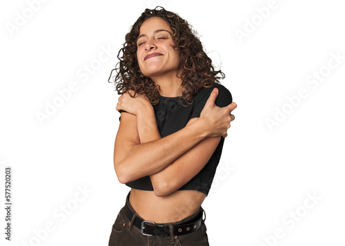 Cuadro en lienzo Radiant young woman with stunning curls hugs, smiling carefree and happy