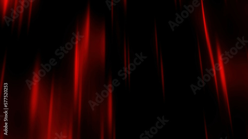 Dark background. Motion. Thin beams of red in the animation scatter slowly in different directions through the darkness.