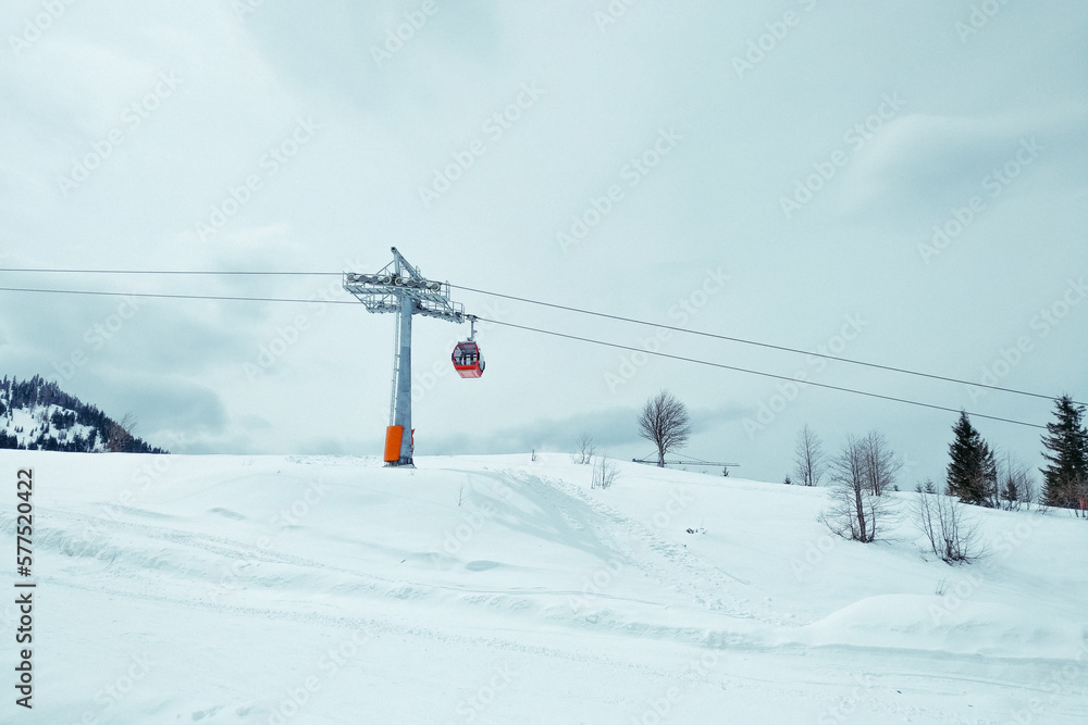 ski resort Goderdzi, Georgia. mountains are covered with snow. Red cable car above and mountains behind - Image ski resort Goderdzi, Georgia. mountains are covered with snow. Red cable car above and mountains behind - Image