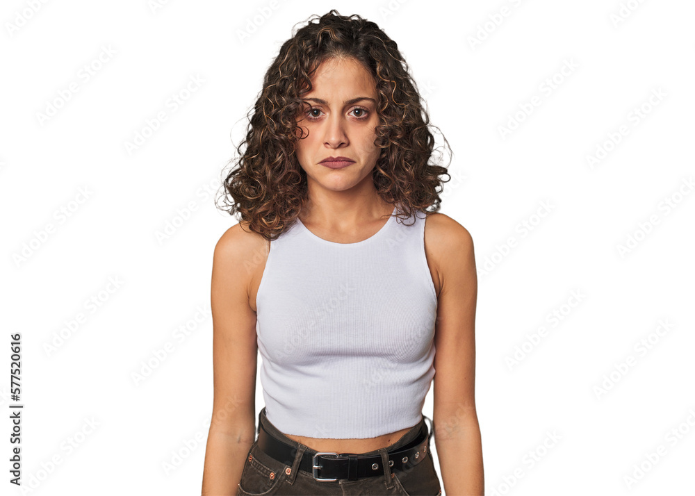 Radiant young woman with stunning curls sad, serious face, feeling miserable and displeased. Radiant young woman with stunning curls sad, serious face, feeling miserable and displeased.