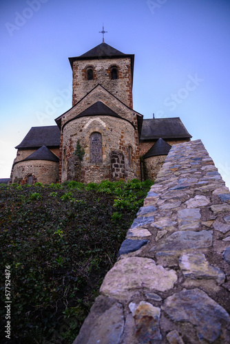 Small medieval church in Laval France, Mayenne with wall in foreground