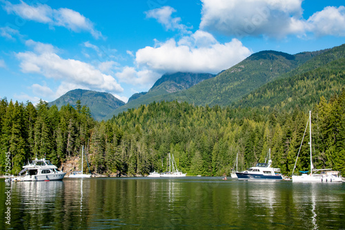 Canvas Print Desolation Sound Community of Yachts Boats Near Mountains in Summer on Strait of