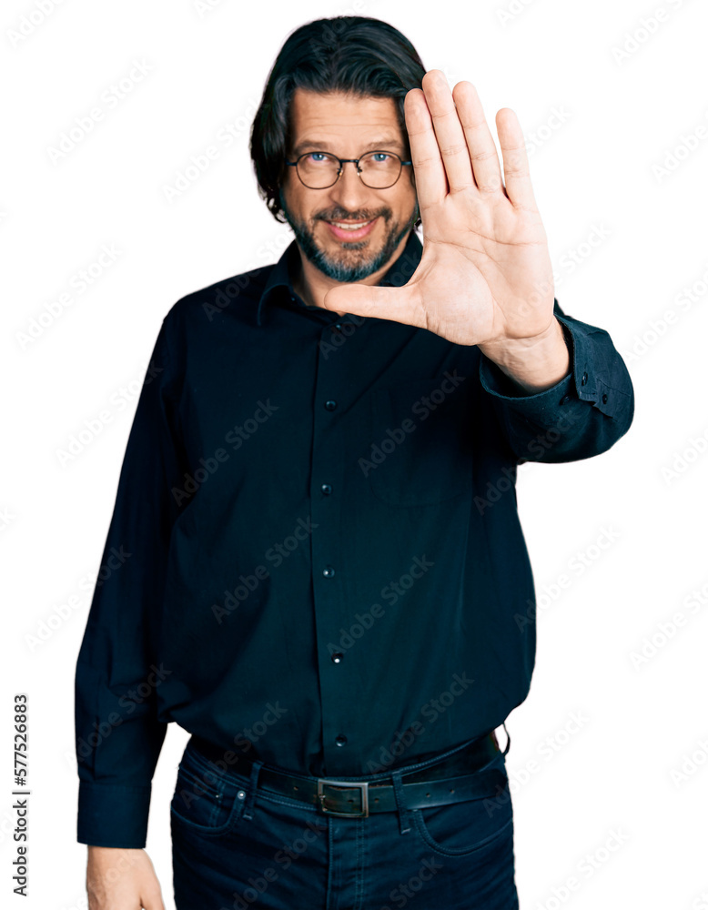Middle age caucasian man wearing casual clothes and glasses doing stop sing with palm of the hand. warning expression with negative and serious gesture on the face. Middle age caucasian man wearing casual clothes and glasses doing stop sing with palm of the hand. warning expression with negative and serious gesture on the face.