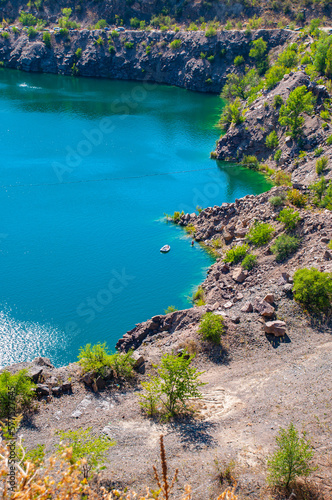 Landscape overlooking a stone quarry filled with water