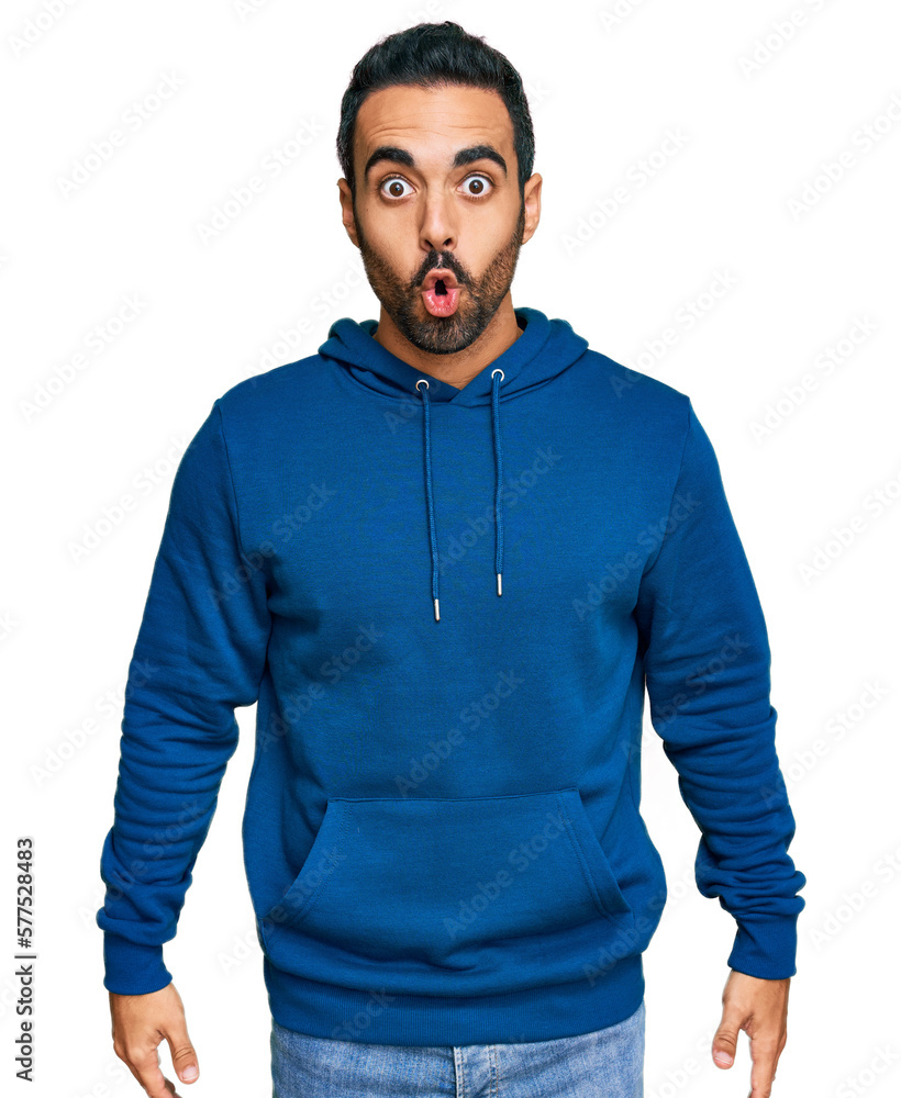 Young hispanic man wearing casual clothes scared and amazed with open mouth for surprise, disbelief face Young hispanic man wearing casual clothes scared and amazed with open mouth for surprise, disbelief face