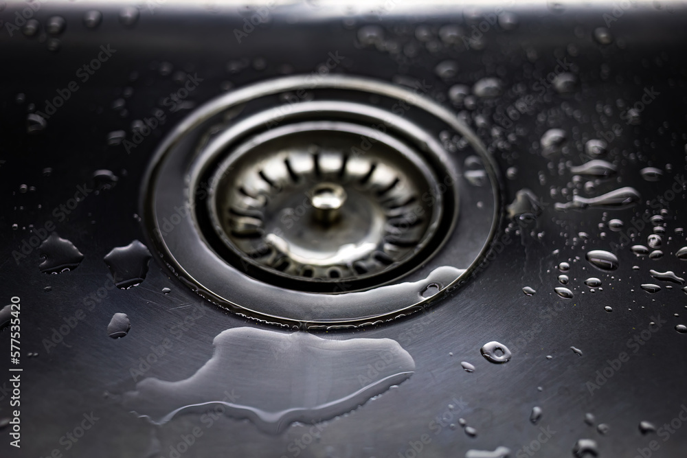 Drain in stainless steel sink with a mesh lid close-up Drain in stainless steel sink with a mesh lid close-up