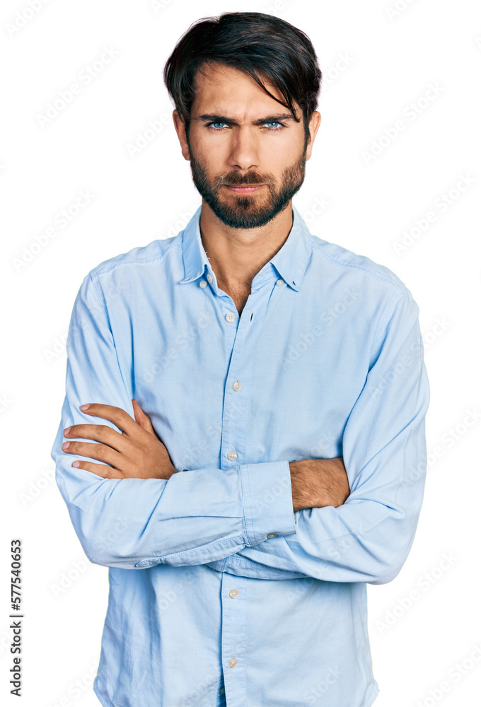 Hispanic man with blue eyes with arms crossed gesture skeptic and nervous, frowning upset because of problem. negative person. Hispanic man with blue eyes with arms crossed gesture skeptic and nervous, frowning upset because of problem. negative person.