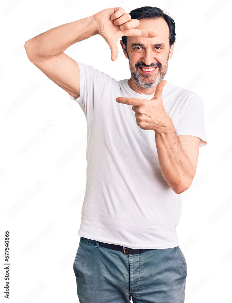 Middle age handsome man wearing casual t-shirt smiling making frame with hands and fingers with happy face. creativity and photography concept. Middle age handsome man wearing casual t-shirt smiling making frame with hands and fingers with happy face. creativity and photography concept.