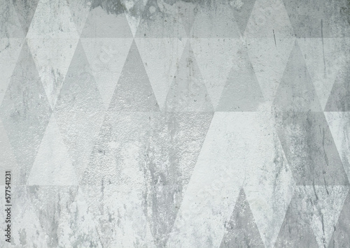 Grey geometrical old triangles wallpaper on concrete. Texture © Batsa