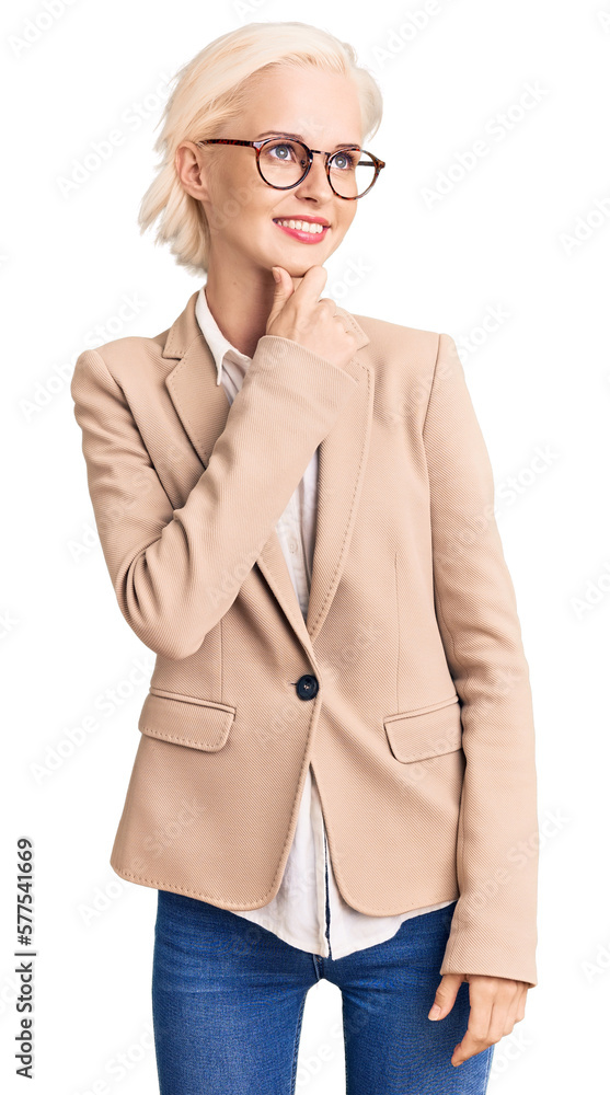 Young blonde woman wearing business clothes and glasses with hand on chin thinking about question, pensive expression. smiling with thoughtful face. doubt concept. Young blonde woman wearing business clothes and glasses with hand on chin thinking about question, pensive expression. smiling with thoughtful face. doubt concept.