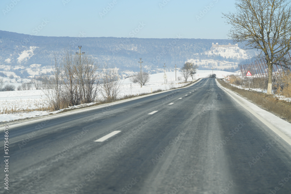 the road without road traffic in a mountainous area in winter. the road without road traffic in a mountainous area in winter.
