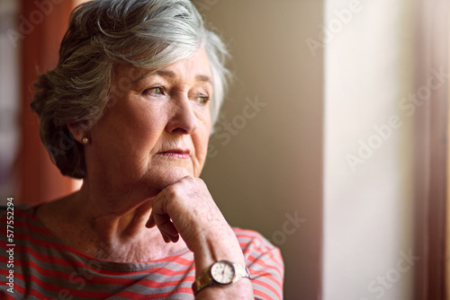 She has a lot on her mind. Shot of a senior woman looking thoughtful.