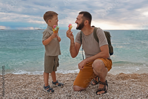 Summer vacation of happy family. Son and father eat ice cream at sea in Croatia.Summer vacation.Happy lifestyle childhood concept.