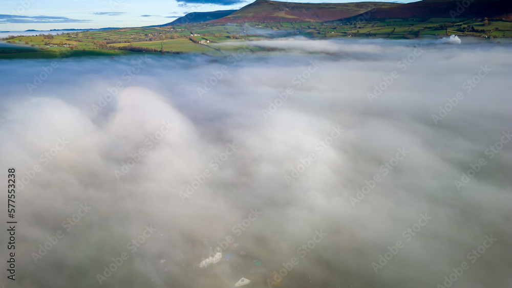 Aerial view of low lying fog above farmers fields