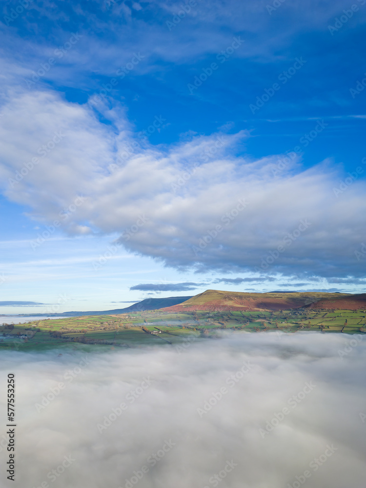 Aerial view of low lying fog over a rural farming area (Llangorse, Wales)