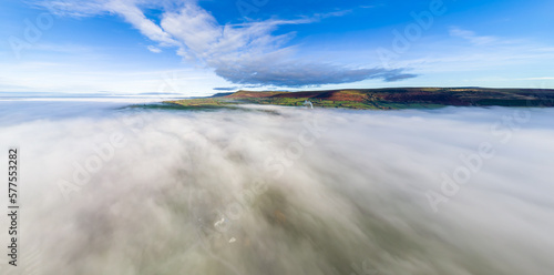 Aerial panorama of low fog and distant mountains