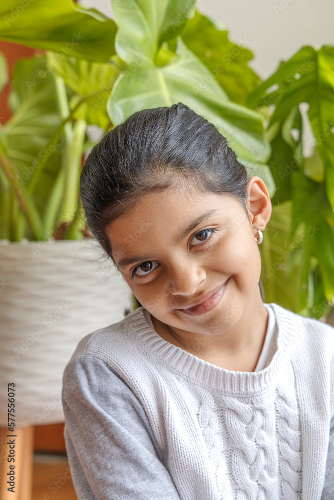 Cute happy girl, because she enjoys the plants