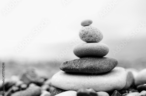 zen stones on the beach. black and white toned image 