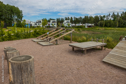 View of gym with wooden sports equipment in open air in villa village. Sweden.