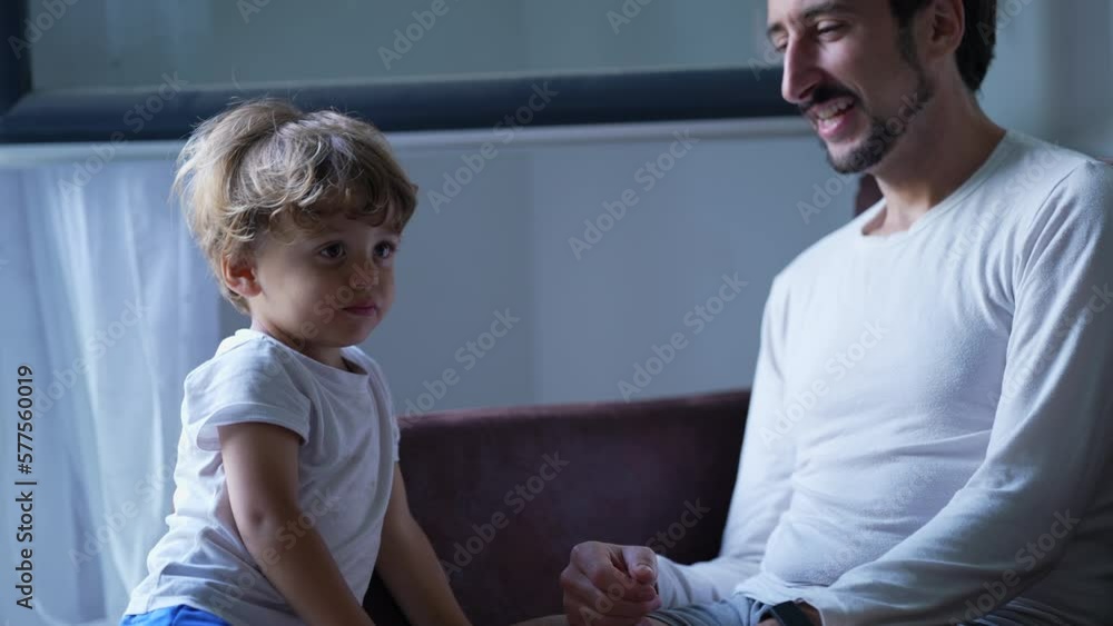 Father and son loving relationship interaction. Real life authentic lifestyle parenting concept. Child embracing and kissing dad Father and son loving relationship interaction. Real life authentic lifestyle parenting concept. Child embracing and kissing dad