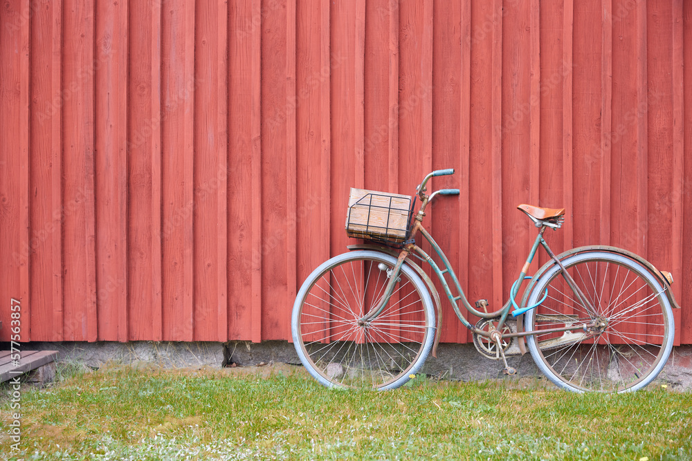 Bicycle with Front Basket Leaning on Red Barn Bicycle with Front Basket Leaning on Red Barn