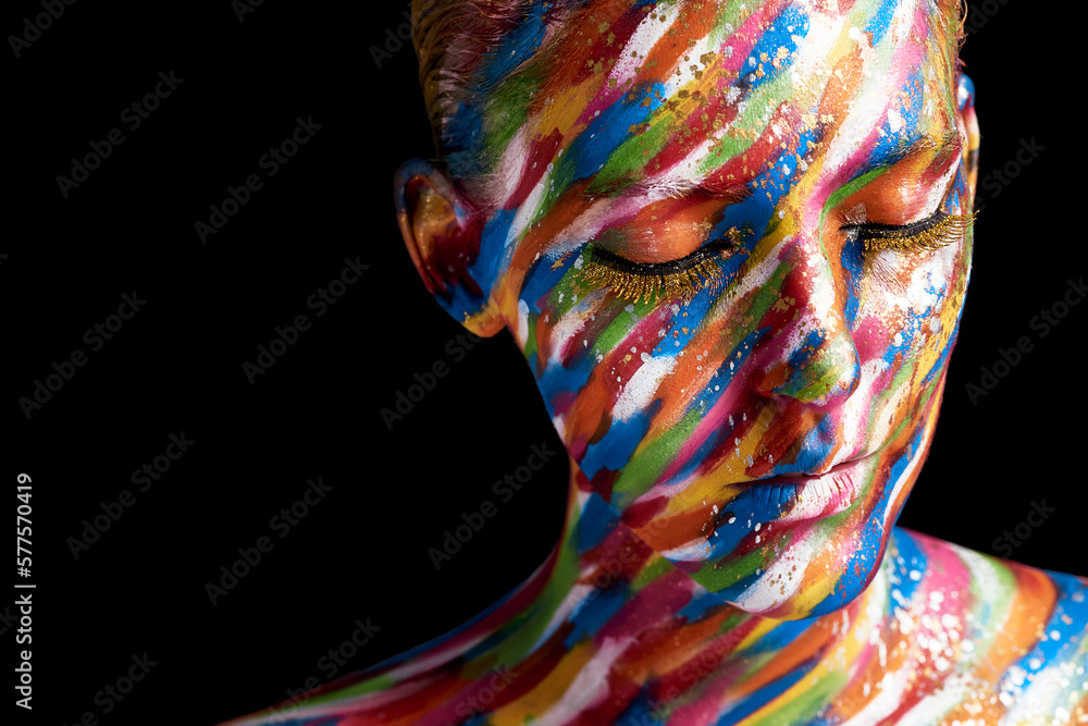 Her face is a canvas for creativity. Cropped shot of a young woman posing with paint on her face.