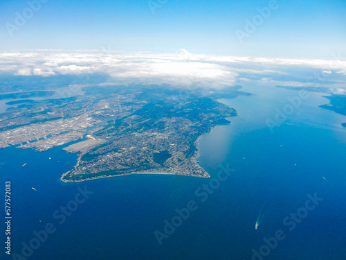 Flying in a Commercial Airliner looking out the window at the Ocean near Seattle, Washington