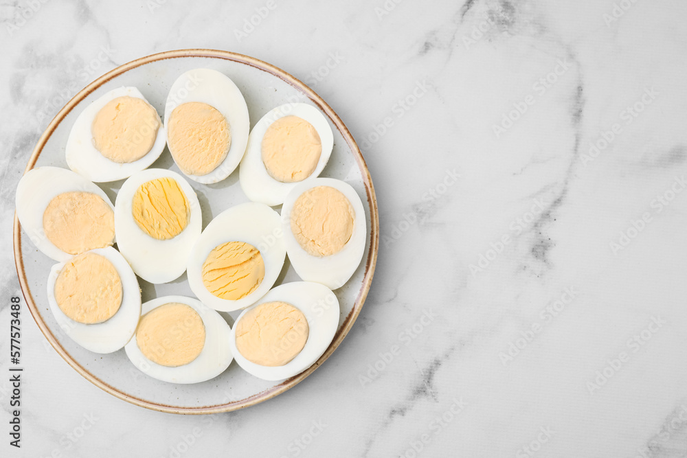 Fresh hard boiled eggs on white marble table, top view. Space for text Fresh hard boiled eggs on white marble table, top view. Space for text
