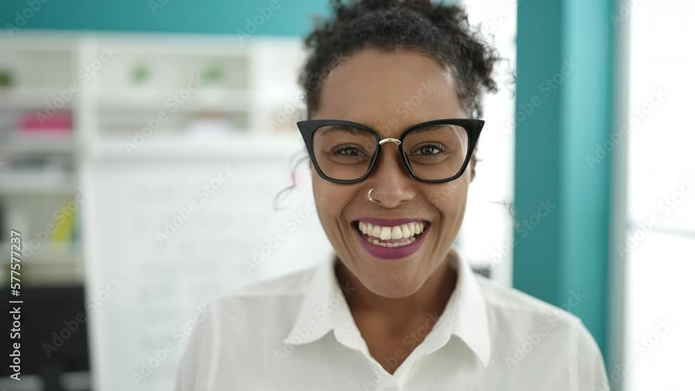 African american woman student smiling confident standing at library university African american woman student smiling confident standing at library university