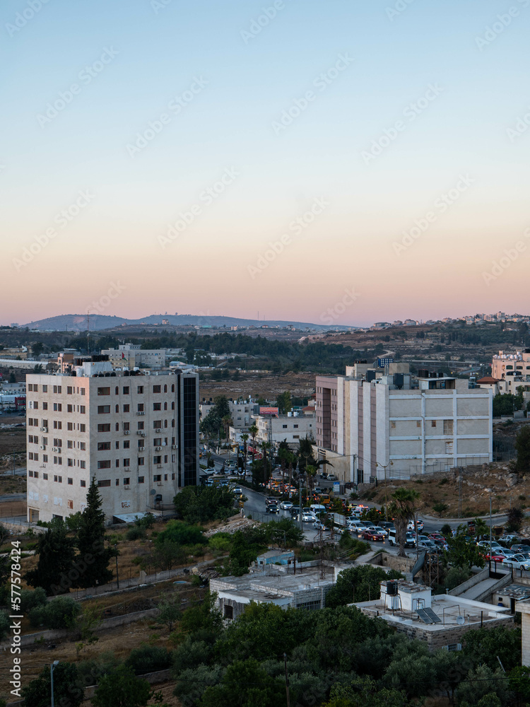 White Buildings with Trees and Red Warning Sign that Reads