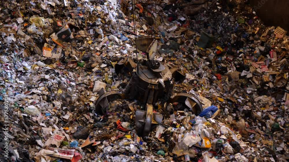 Unsorted garbage is collected by a special crane claw for incineration at the factory. Recycling of garbage. Fuel for thermal power plants. Unsorted garbage is collected by a special crane claw for incineration at the factory. Recycling of garbage. Fuel for thermal power plants.