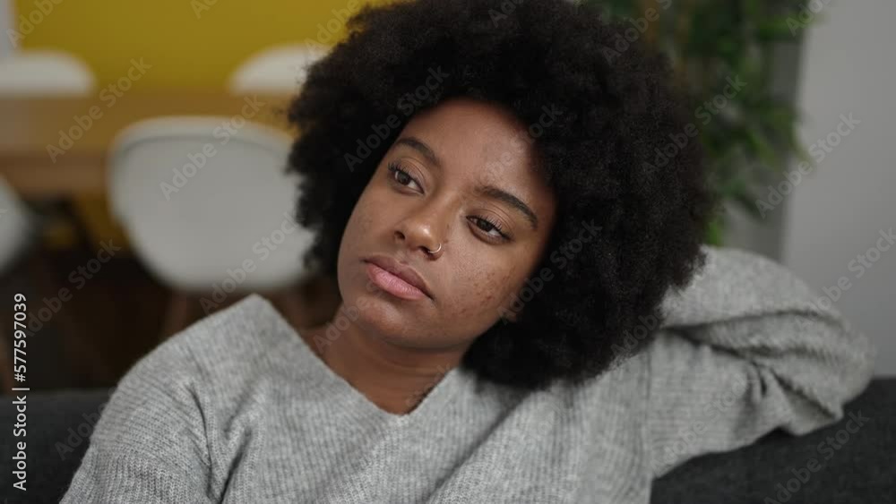 African american woman relaxed on sofa at home African american woman relaxed on sofa at home