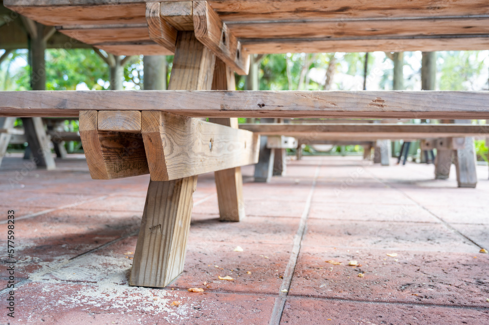 Spilled drink on a wooden picnic bench.