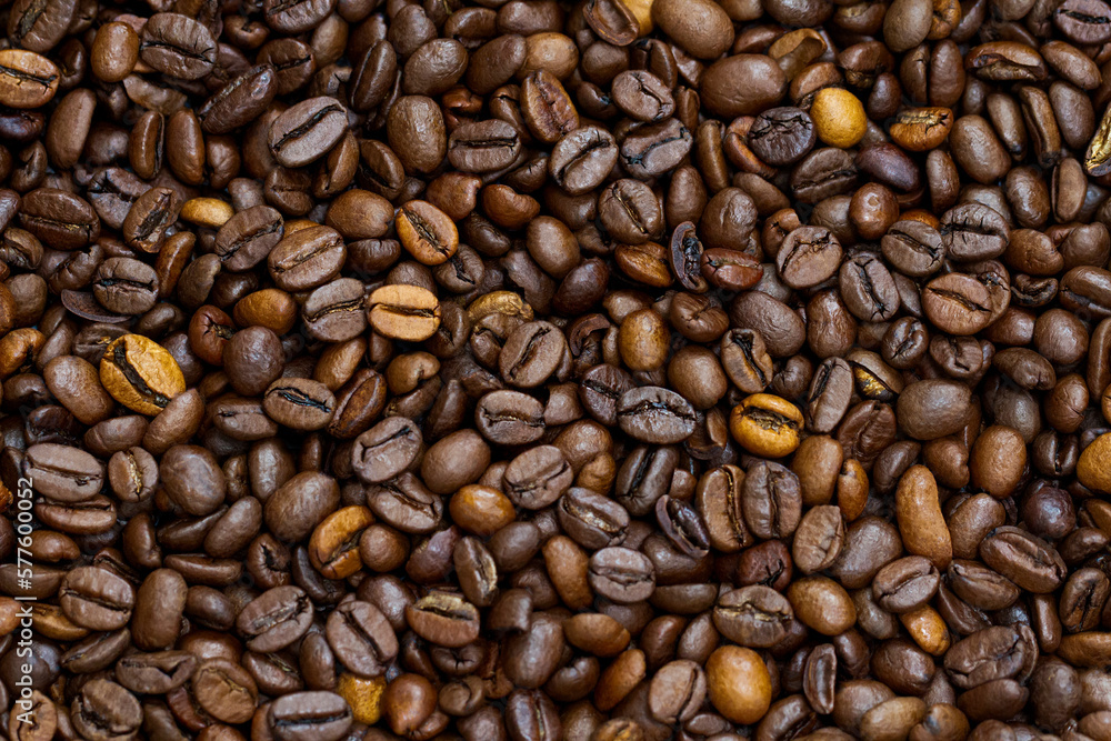 Roasted dark coffee beans background. Multi color