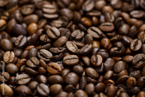 Roasted coffee beans close up background with central line focus
