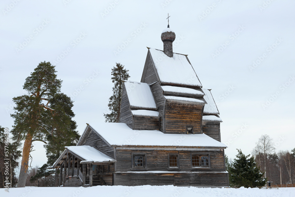 Ancient wooden church of George the Victorious (1522) on a gloomy February day, Russia Ancient wooden church of George the Victorious (1522) on a gloomy February day, Russia