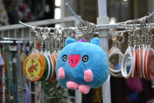 Keychain with a blue piggy doll.
