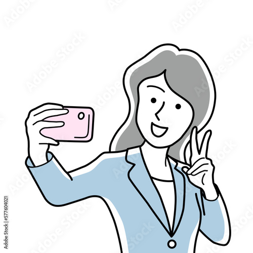 スマホで自撮りするビジネスウーマン
