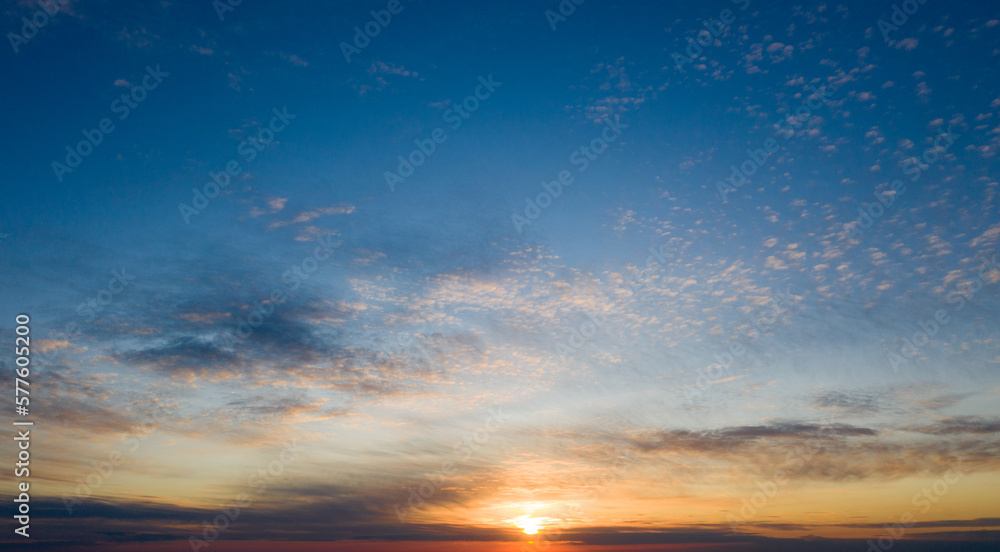 Fototapeta premium Sunset with sun rays, sky with clouds and sun.