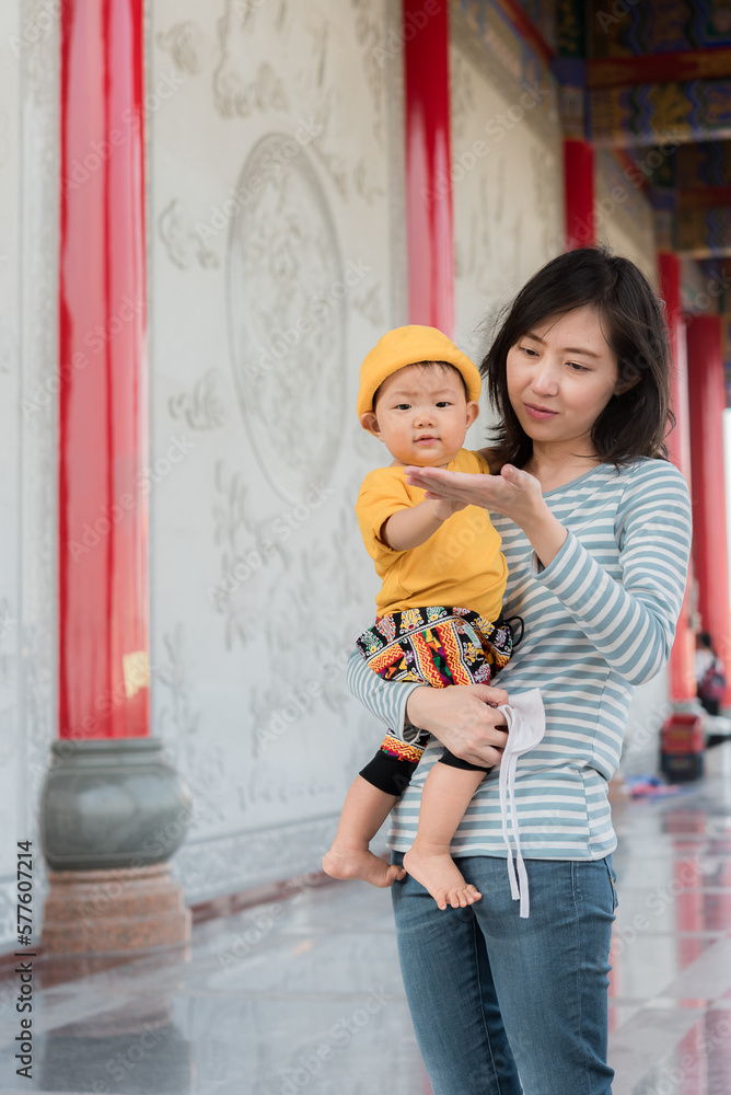 Chinese mother and son at temple